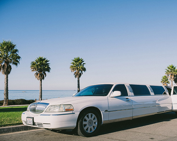 Limousine parked infront of beach